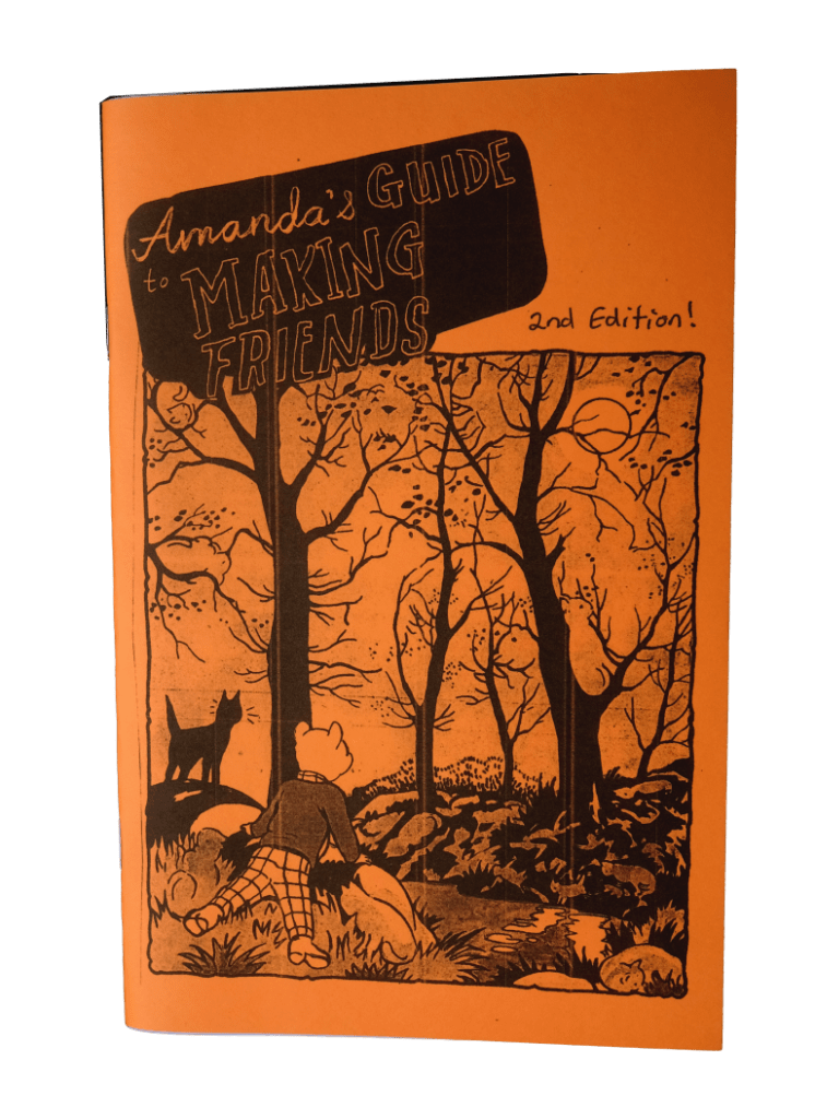 "Amanda's Guide to Making Friends", with a cover printed on bright orange paper. The cover illustration comes from Rupert Bear comic, and shows a bear with a sweater and plaid trousers, and a black cat, both looking out over a forest.